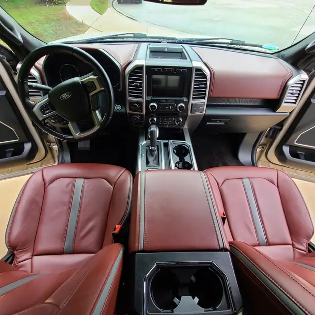 Ford F-150 interior with oxblood leather seats after an interior detail